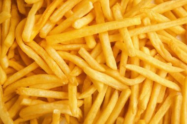 Arka plan olarak bir yığın lezzetli patates kızartması.