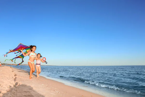 Cute Little Girls Flying Rainbow Kite Sea Beach — Stock Photo, Image