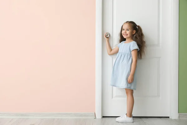 Cute Little Girl Standing Closed Door — Stock Photo, Image