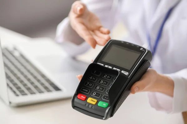 https://st2.depositphotos.com/10614052/46325/i/450/depositphotos_463257898-stock-photo-doctor-payment-terminal-clinic-closeup.jpg