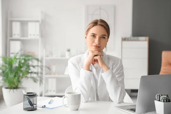 Portrait of female psychologist in office