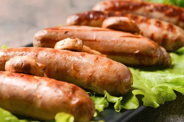 Plate Delicious Grilled Sausages Grunge Background Closeup — Stock Photo, Image