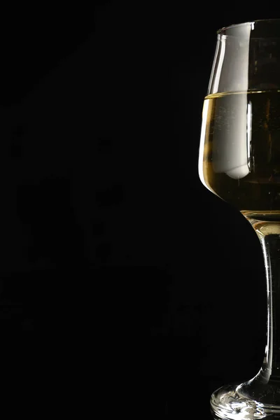 Glass of wine on dark background