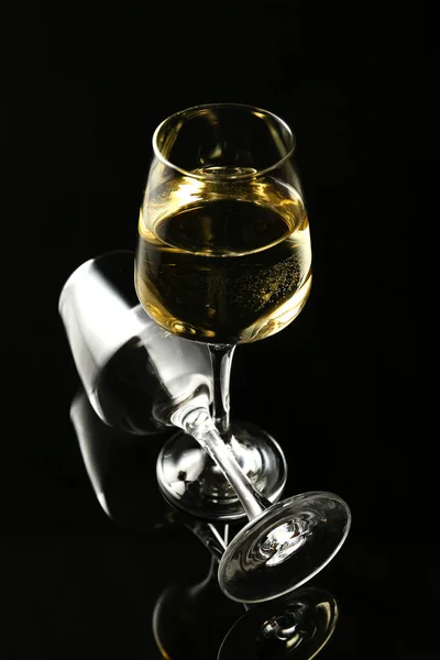 Glasses of wine on dark background