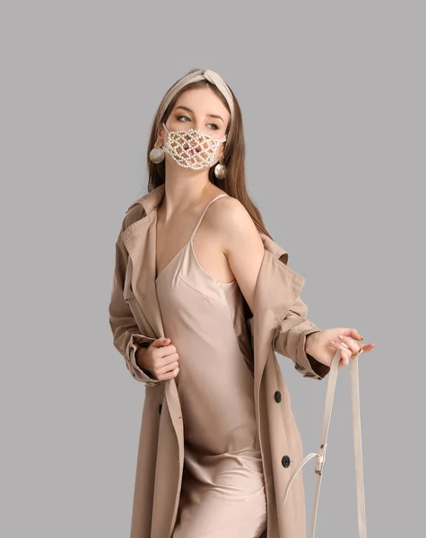 Fashionable Young Woman Wearing Mask Grey Background — Stock Photo, Image