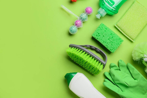 Set of cleaning supplies on color background