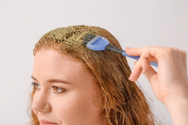 Young Woman Using Henna Hair Dye Light Background — Stock Photo, Image