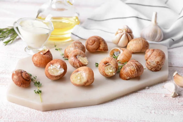 Board Tasty Snails Light Wooden Background — Stock Photo, Image