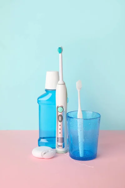 Set for oral hygiene on color background