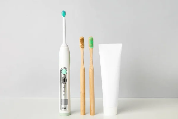 Different Tooth Brushes Paste Light Background — Stock Photo, Image