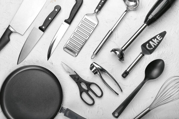 Set of kitchen utensils on light background