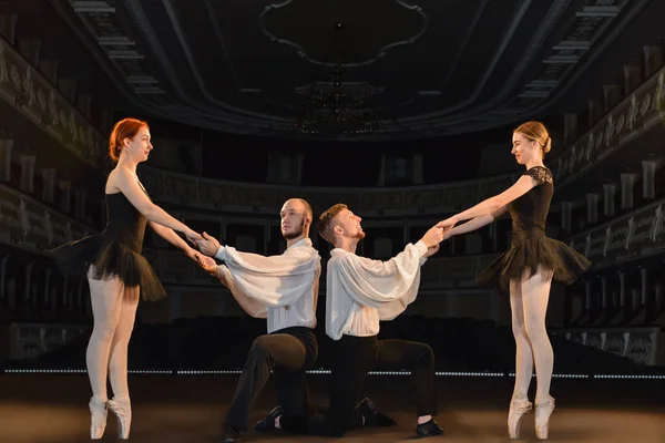 Dancers on stage in ballet theatre