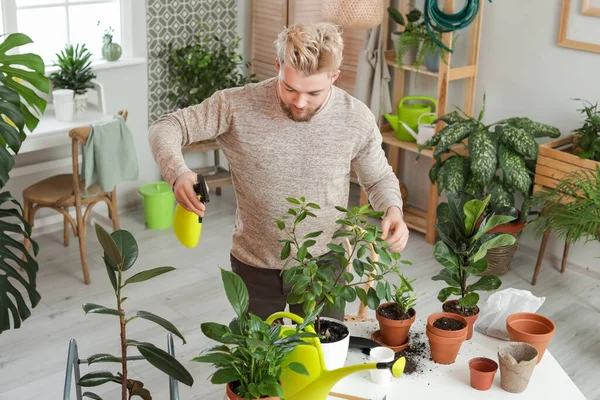 Young Man Taking Care Plants Home — Stock Photo, Image
