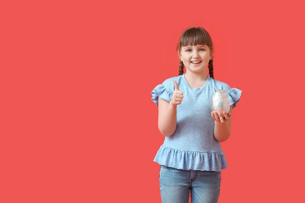 Cute Little Girl Chocolate Easter Egg Showing Thumb Color Background — Stock Photo, Image