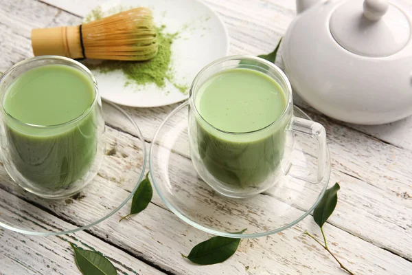 Samenstelling Met Kopjes Matcha Thee Poeder Lichte Houten Ondergrond — Stockfoto