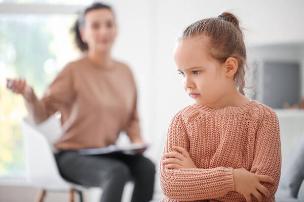 Sad little girl at child psychologist's office