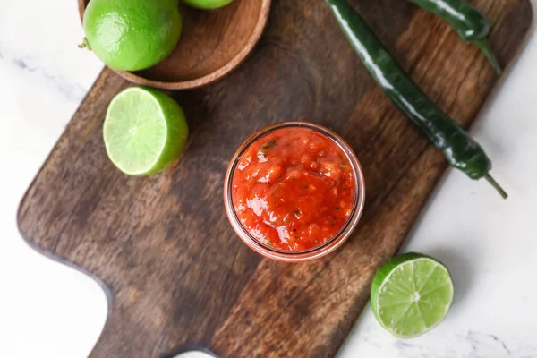 Wooden Board Jar Tasty Salsa Sauce Ingredients Light Background — Stock Photo, Image