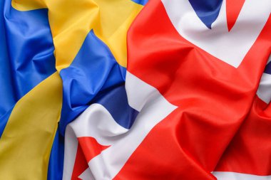 Arka plan olarak İsveç ve İngiltere bayrakları