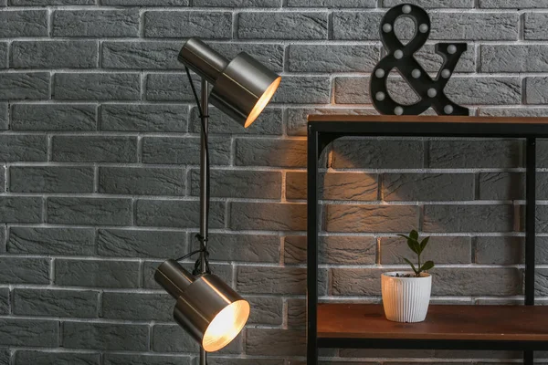 Glowing Lamps Shelf Decor Brick Background — Stock Photo, Image