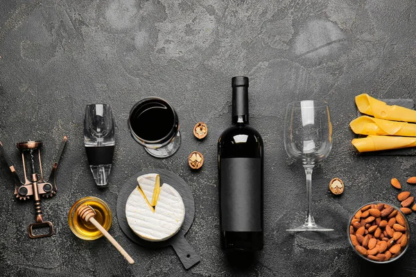 Composition with bottle of wine on dark background