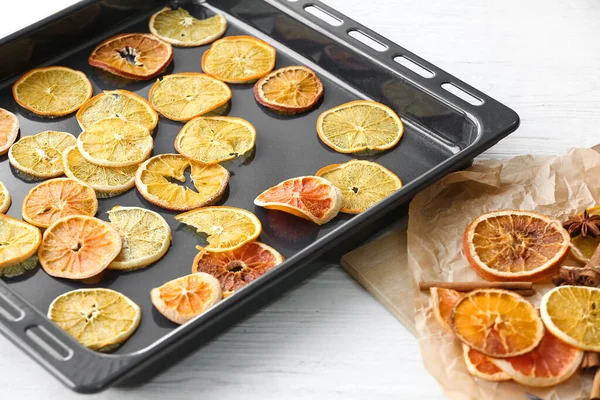 Baking Sheet Dried Orange Slices Light Wooden Background — Stock Photo, Image