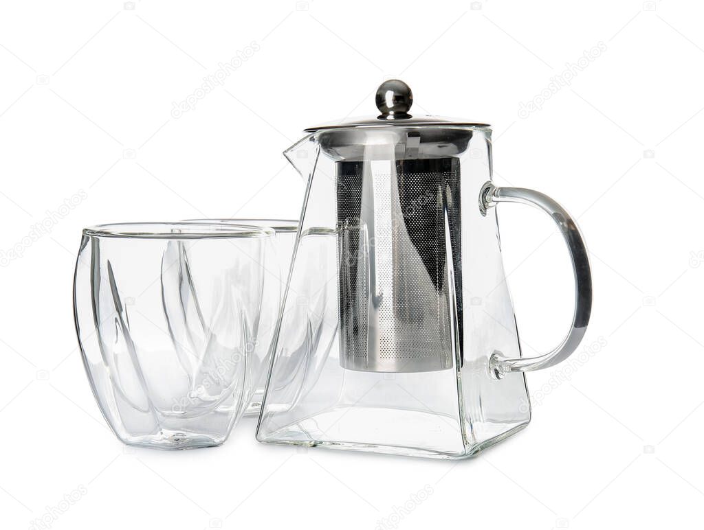 Teapot and glasses on white background