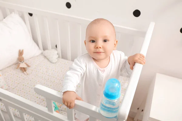 Cute Little Baby Bottle Water Crib Home — Stock Photo, Image