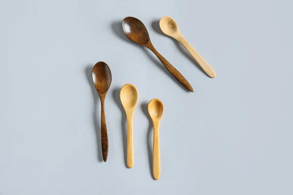 Different Wooden Spoons Light Background — Stock Photo, Image