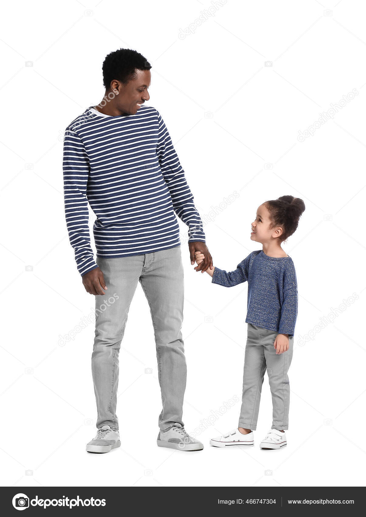 Portrait Of Happy Family Walking Over White Background Against