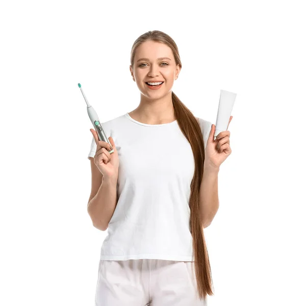 歯ブラシと白の背景にペーストを持つ若い女性 — ストック写真
