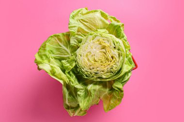 Fresh cut cabbage on color background clipart