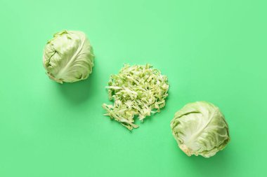 Fresh cabbages on color background clipart
