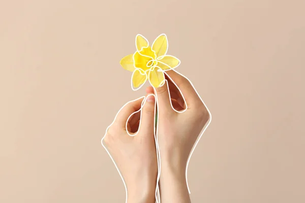 Female hands with narcissus on color background