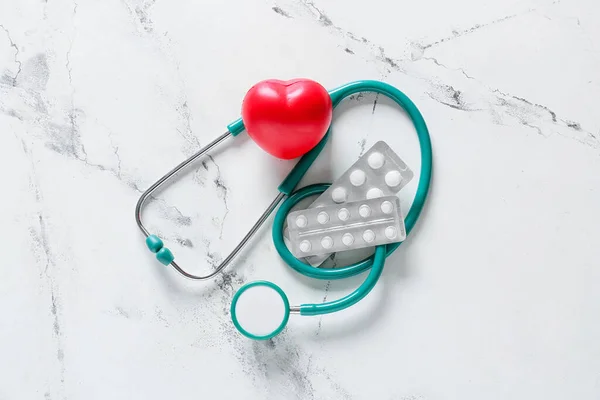 Modern Stethoscope Heart Pills Light Background — Stock Photo, Image