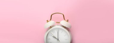 Alarm clock on color background with space for text