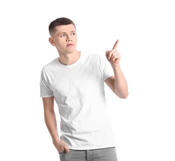 Junger Mann Zeigt Auf Etwas Auf Weißem Hintergrund — Stockfoto