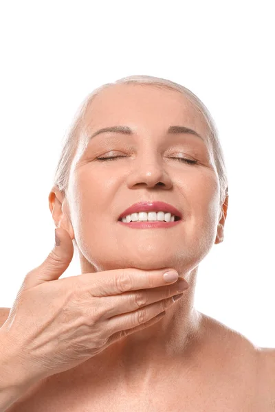 Gammal Kvinna Ger Sig Själv Ansikte Massage Vit Bakgrund — Stockfoto