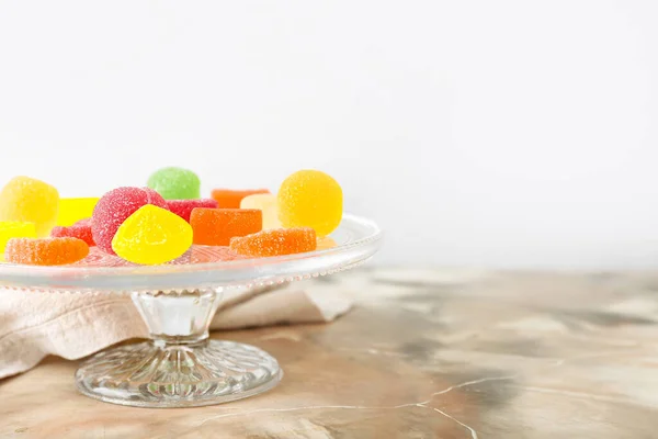 Dessert Stand Tasty Jelly Candies Light Background — Stock Photo, Image