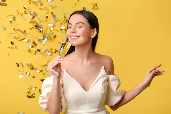 Beautiful Woman Drinking Champagne Falling Confetti Color Background — Stock Photo, Image