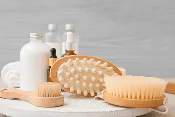 Composition Massage Brushes Cosmetic Products Wooden Background Closeup — Stock Photo, Image