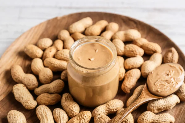 Jar Spoon Tasty Peanut Butter Wooden Background Closeup — Stock Photo, Image