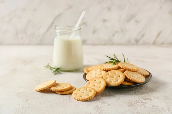 Plate Tasty Crackers Bottle Milk Light Background — Stock Photo, Image