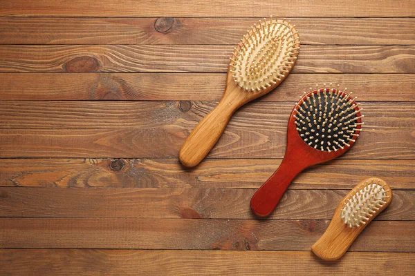 Hair Brushes Wooden Background — Stock Photo, Image