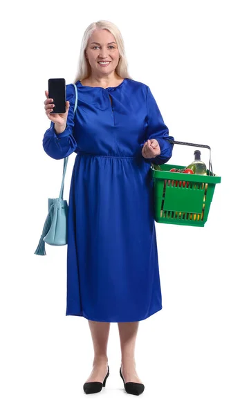 Mature Woman Shopping Basket Mobile Phone White Background — Stock Photo, Image