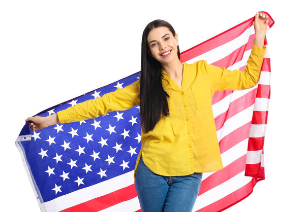 Beautiful young woman with USA flag on white background
