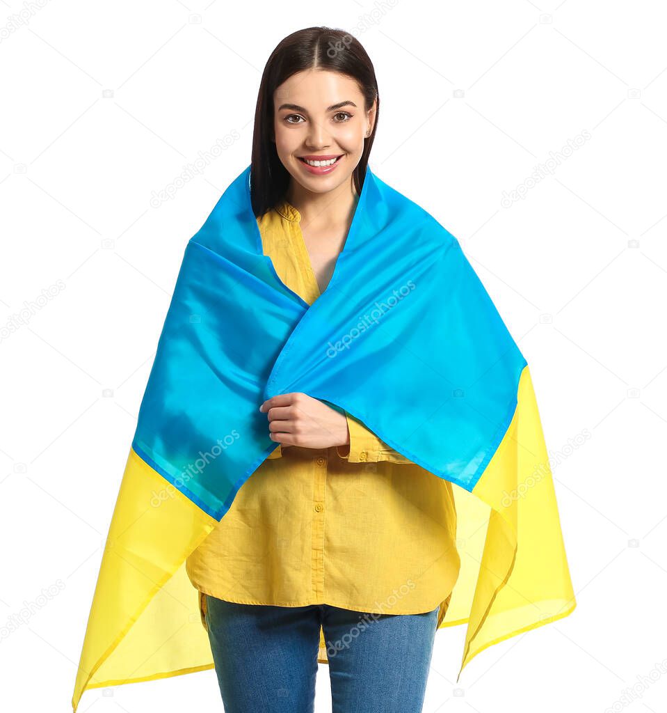 Beautiful young woman with Ukrainian flag on white background