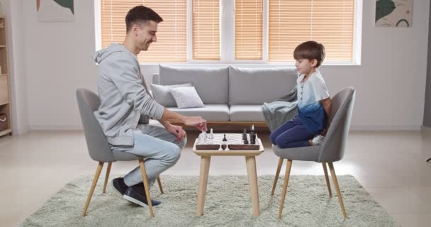 Man His Little Son Playing Chess Home — Stock Video