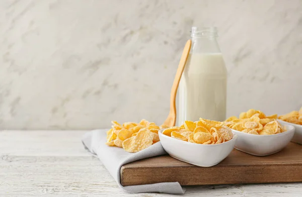 Bowls Tasty Cornflakes Bottle Milk Light Wooden Background — Stock Photo, Image