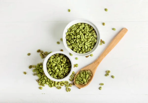 Bowls Spoon Green Coffee Beans Light Background — Stock Photo, Image