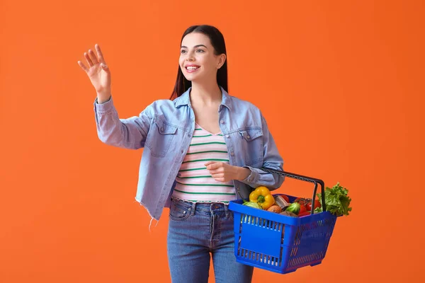 Young Woman Shopping Basket Color Background — Stock Photo, Image